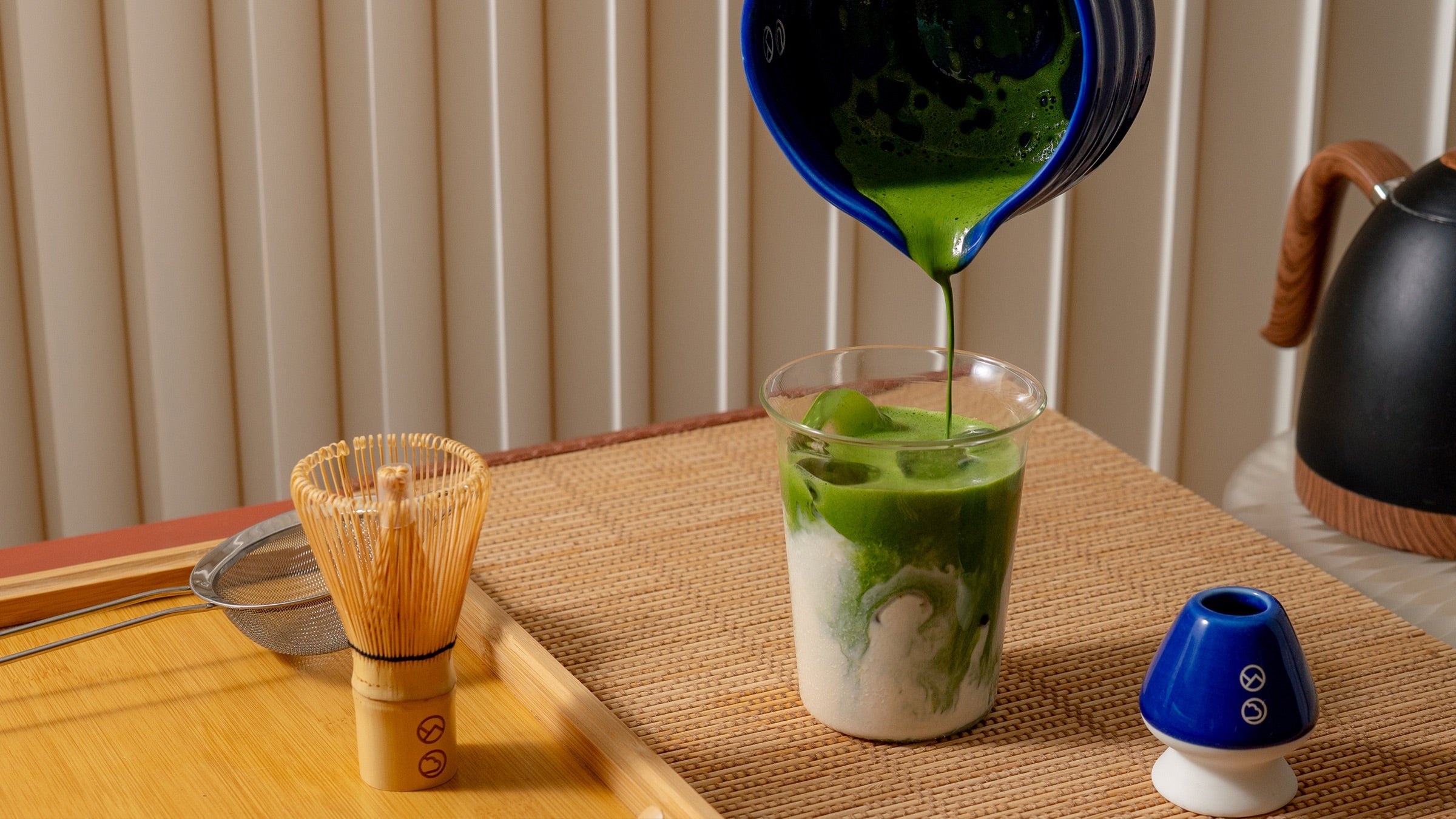Matcha being poured over ice for a daily Forest Cloud ritual