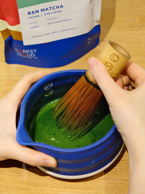 Iced matcha latte layered with milk