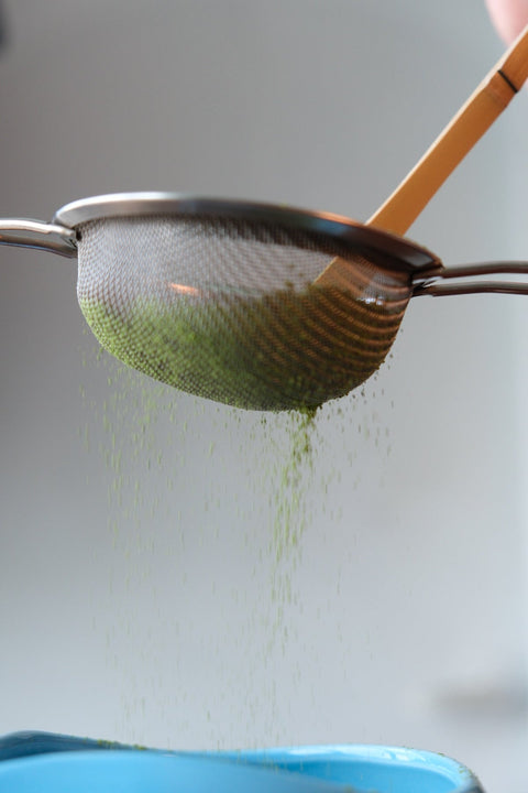 Forest Cloud matcha being sifted before whisking, used to explain how to refresh a settled cup.